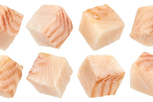 Cod fish fillet cubes isolated, a Food & Drink Photo by Max Lashcheuski