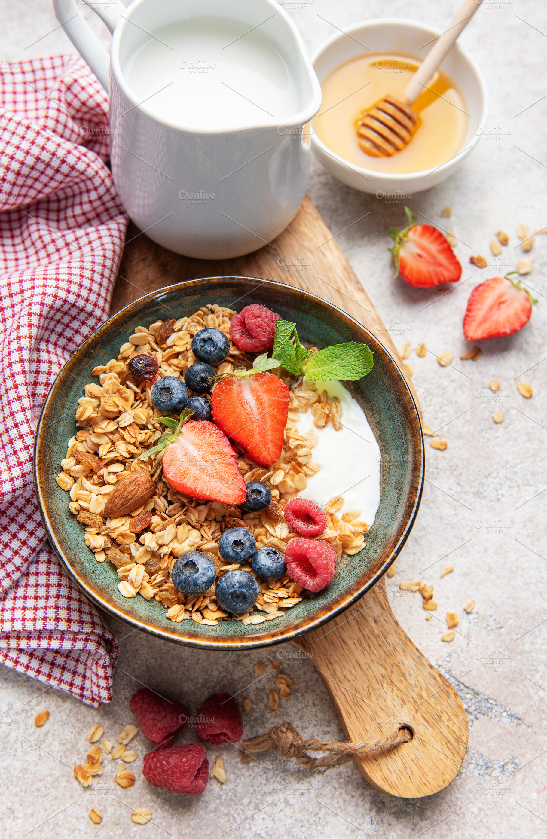 Healthy breakfast granola bowl with fresh berries, a Food & Drink Photo by Olena Rudo
