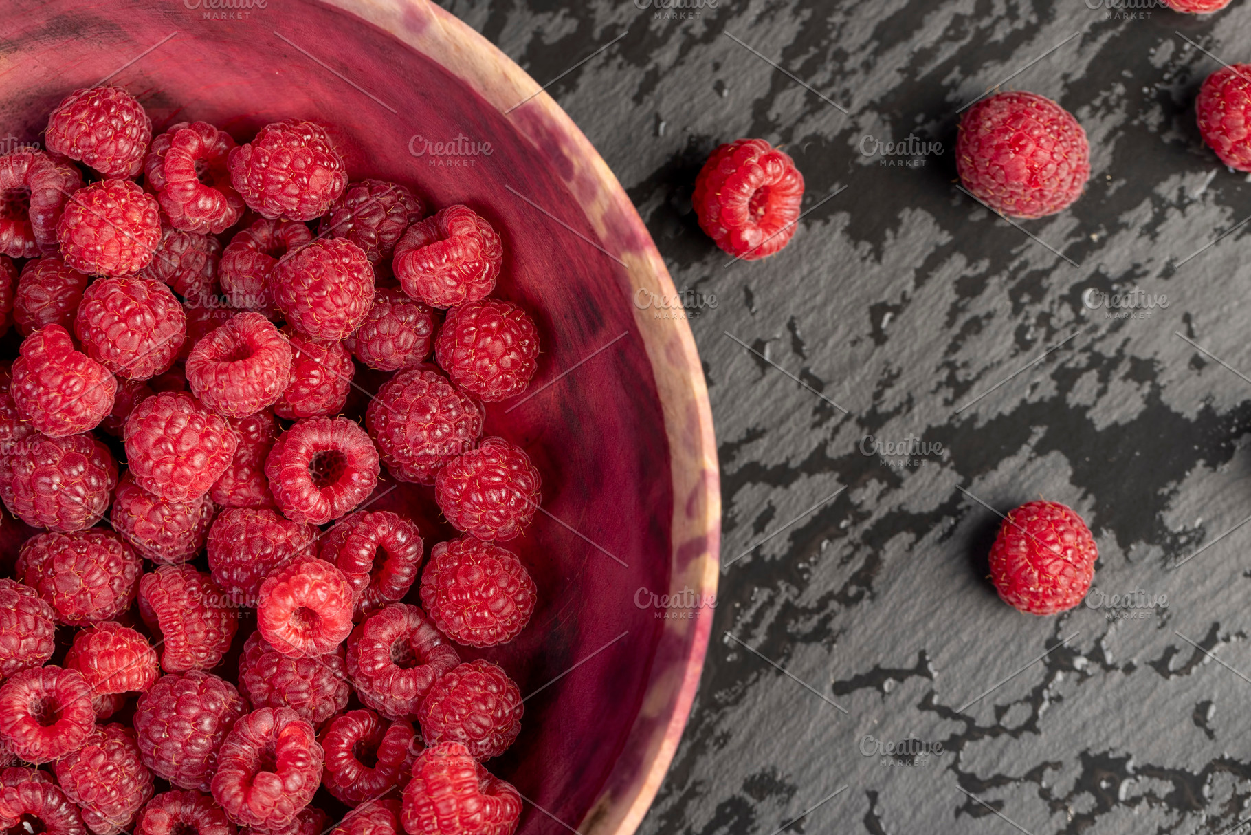 fresh red raspberries on the table, a Photo by rsoollAI