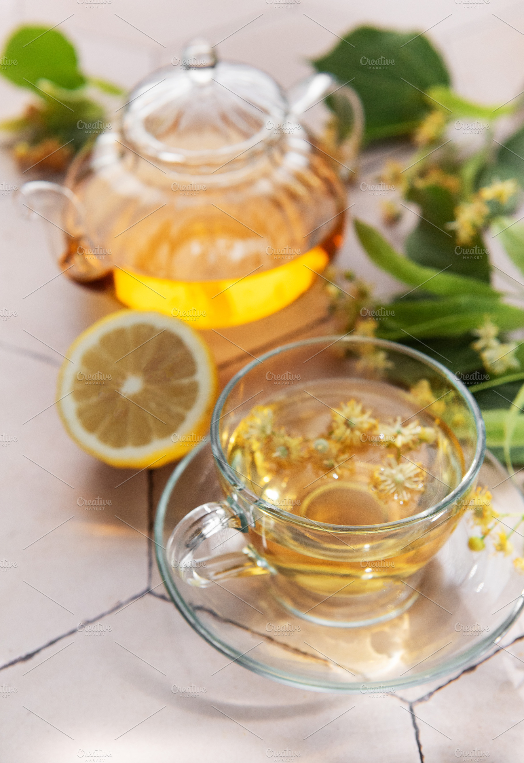 Linden herbal tea in glass cup and teapot, a Food & Drink Photo by Olena Rudo