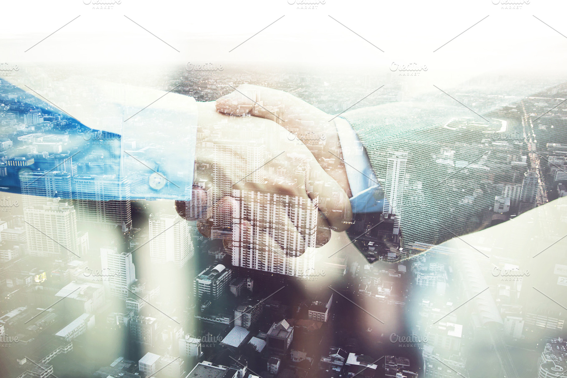 Double exposure of businessmen in suit handshaking agreed upon partnership, a Business Photo by Twinster Photo