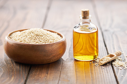 Bowl of sesame seeds and oil bottle., a Food & Drink Photo by chamillewhite
