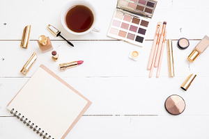 flat lay- desk with tea and cosmetic