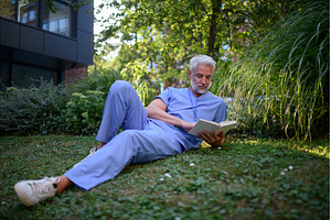 Healthcare worker resting in park, a Health & Medical Photo by HalfPoint