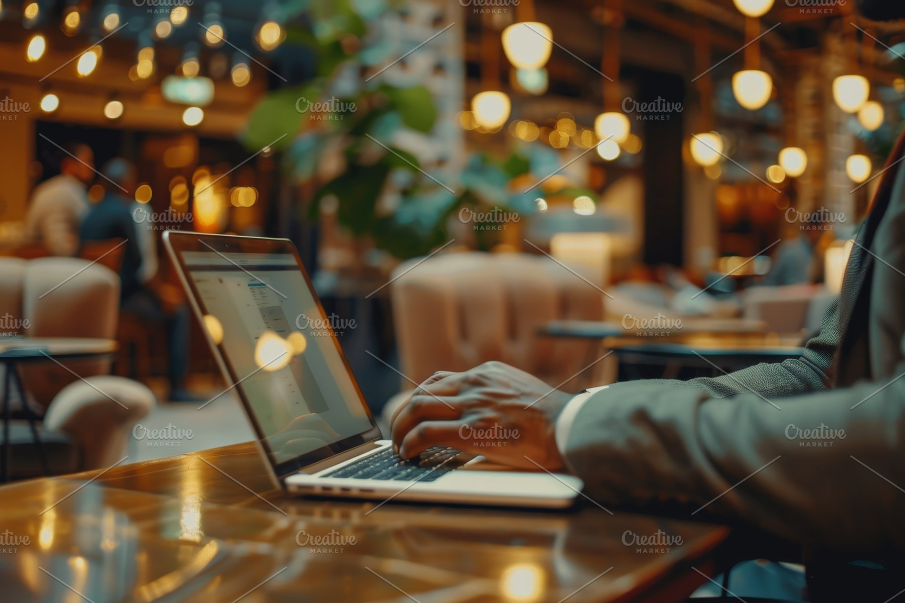 A businessman types on his laptop wh, a Photo by Iftikhar Alam