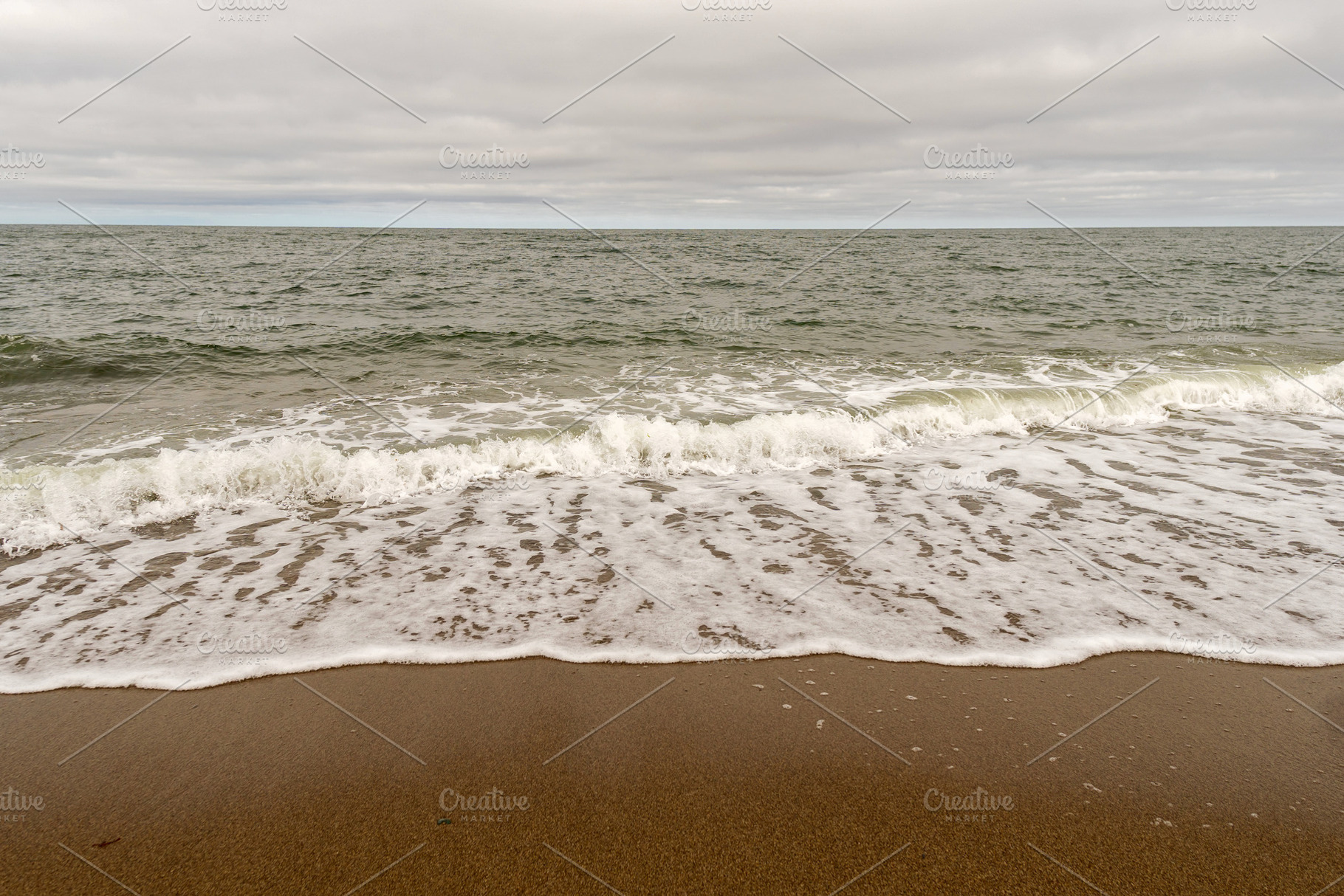 Ocean waves reaching sandy shore, a Nature Photo by Elena Vagengeim
