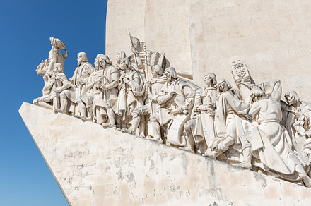 Monument to the discoveries in lisbo containing belem, blue, and buildings