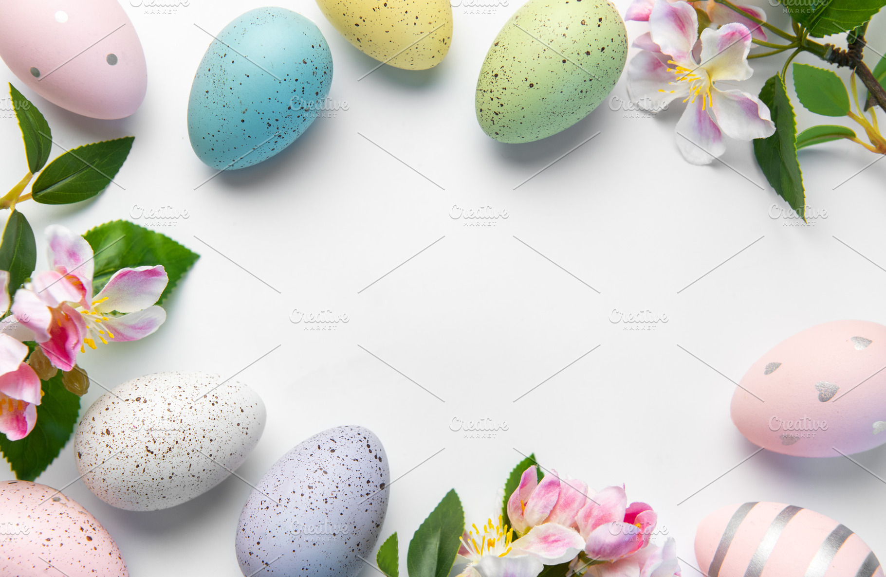 Pastel easter eggs and pink blossoms creating spring border, a Holiday Photo by Olena Rudo