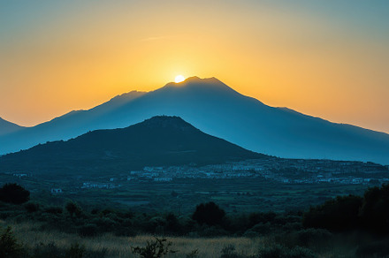 Sunset casts warm glow over mountain, a Photo by Iftikhar Alam