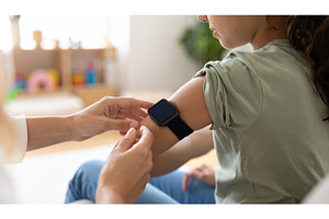 A child wearing a smartwatch getting, a Technology Photo by Igor Tichonow
