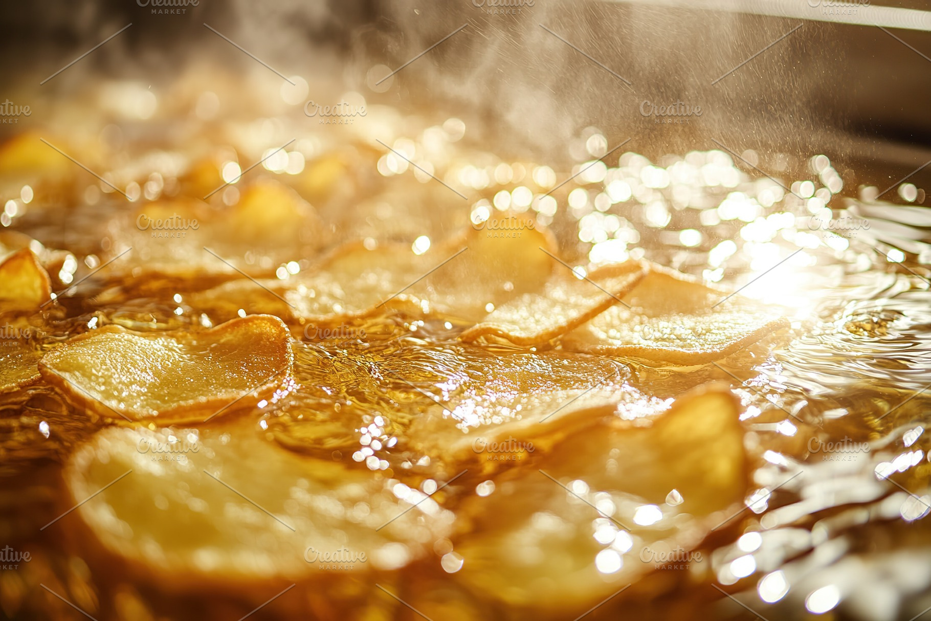 Frying potato chips in oil, a Food & Drink Photo by AlyaAnd