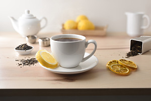 Hot tea on table with lemon tea and kitchen items, a Food & Drink Photo by Davizro's Market