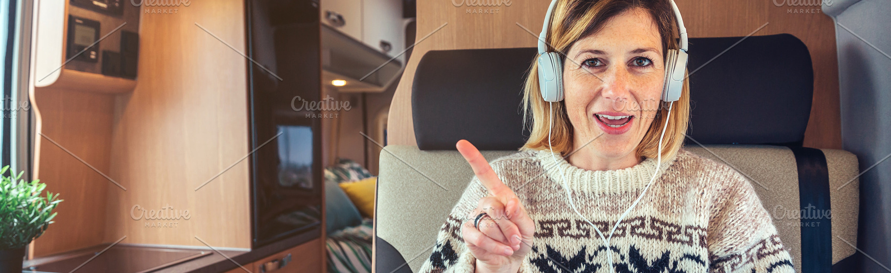 Woman talking looking at camera from her campervan, a Person Photo by davidpereiras