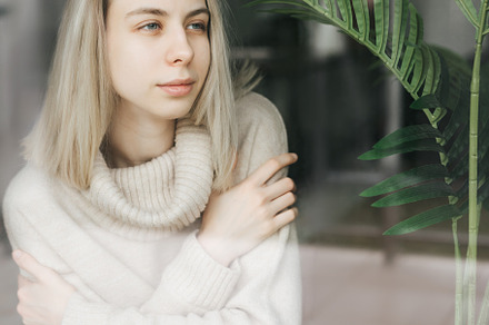 Sad girl near window thinking about something, a Person Photo by Olena Rudo