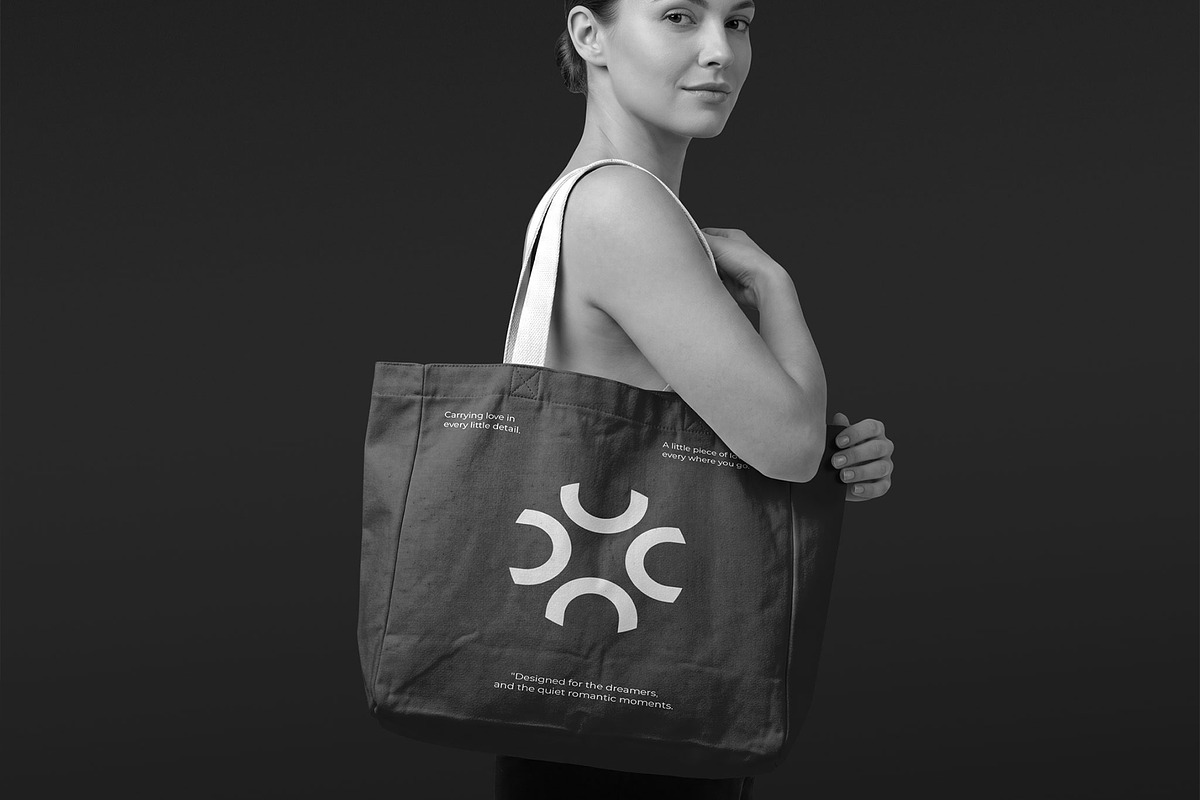 Woman Holding Tote Bag Mockup, a Merchandise Mockup by graphypix (Photo 4 of 4)