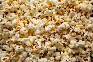 Homemade Butter Popcorn with Salt, top view. Overhead, from abov, a Food & Drink Photo by LiudmylaChuhunova
