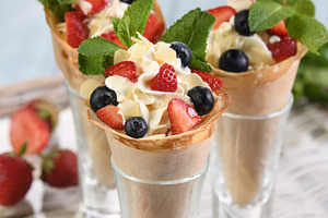 Sweet crepe cones filled with whippe, a Food & Drink Photo by Apolonia