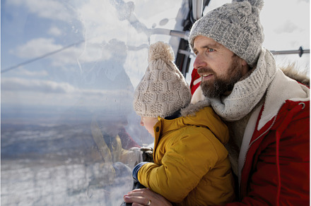 Father and young son on a winter, a Holiday Photo by HalfPoint