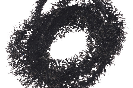 Abstract circular stroke of black pencil with uneven, rough edge