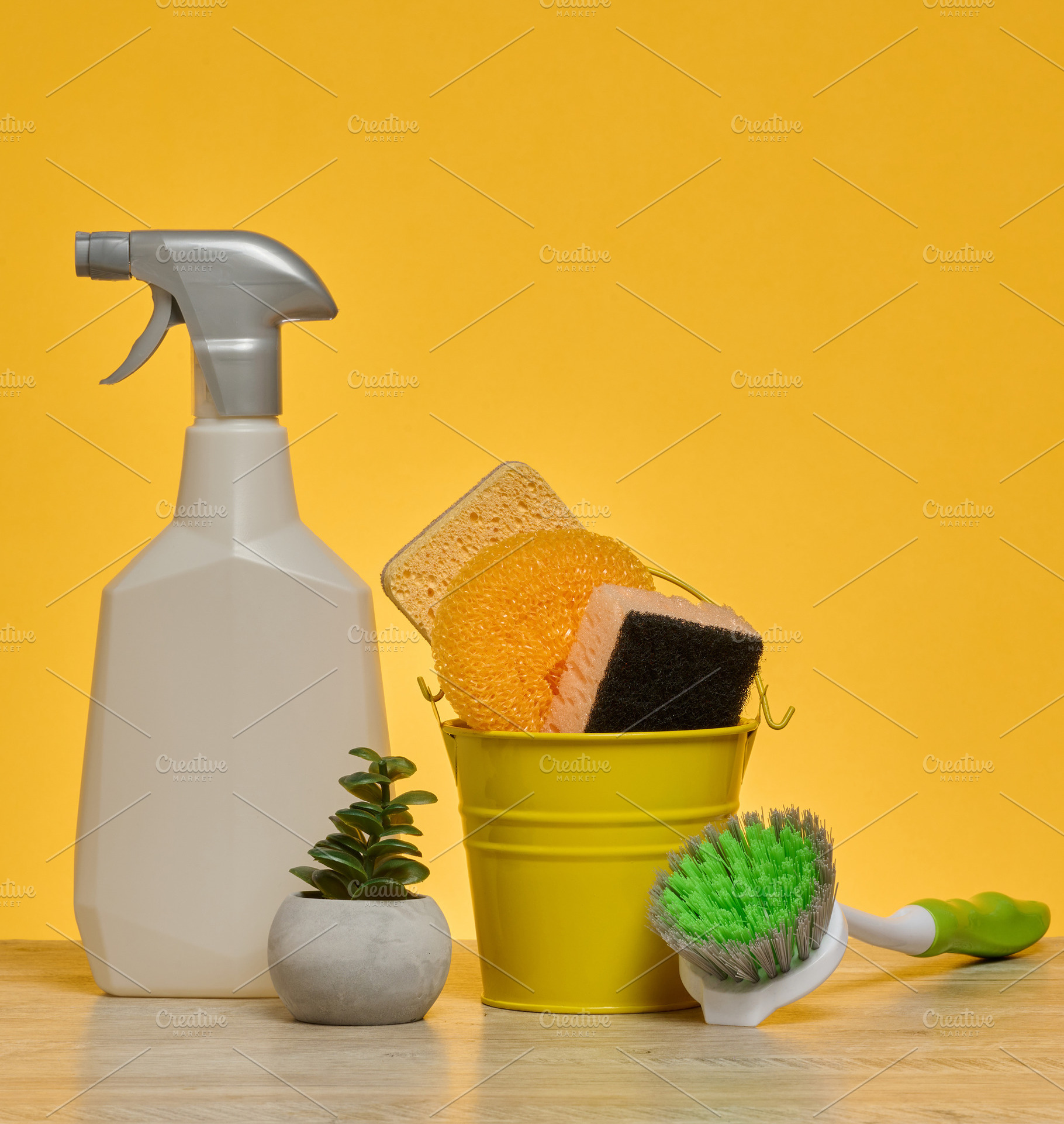 White plastic spray bottle and a stack of multi-colored sponges, a Background Photo by ndanko