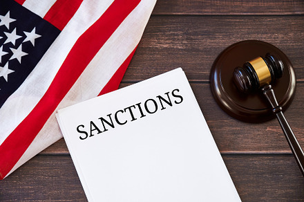 US sanctions list against Russia, judge's gavel, USA flag on wooden table., a Business Photo by photoguns