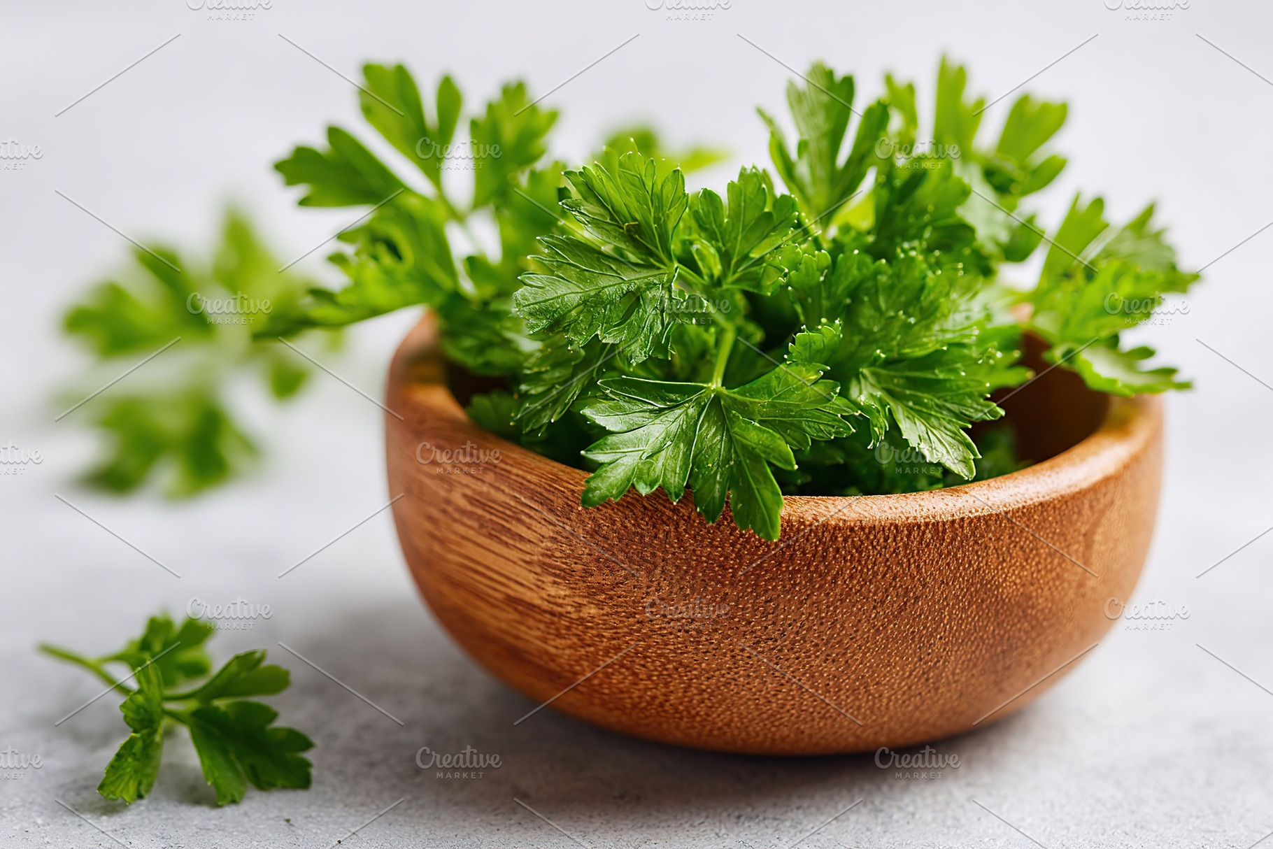 Fresh parsley arranged in a small wooden bowl on a light surface for culinary u, a Food & Drink Photo by AlyaAnd
