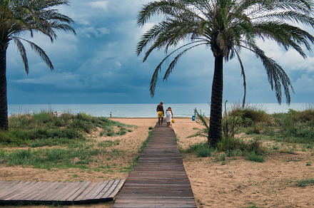 Elderly couple walking on a wooden