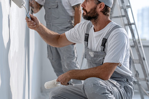 Two Painters Working on Wall Renovat, a Photo by Pixeness Studio