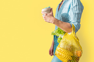 Zero waste shopping  female holding featuring grocery, food, and organic