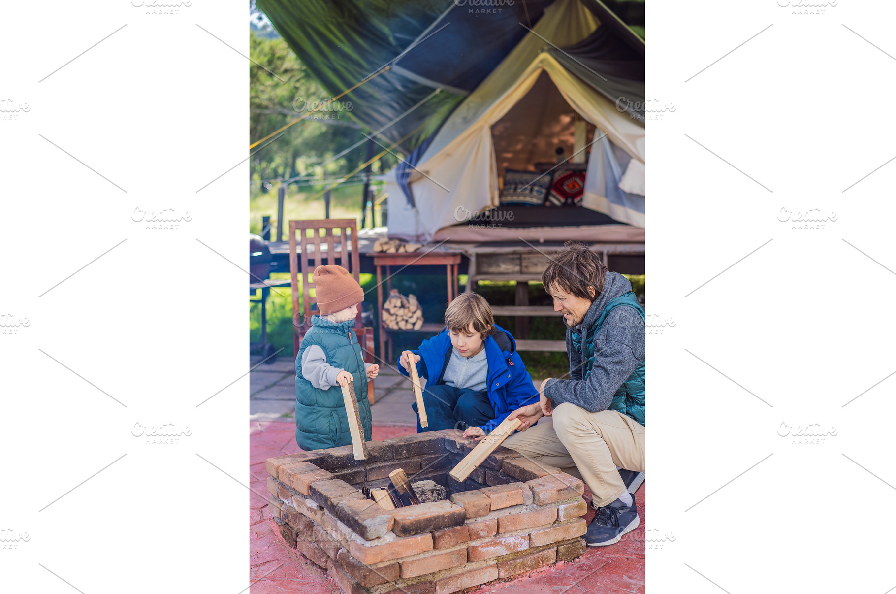 Father and his two sons making a, a Holiday Photo by Elizaveta Galitskaya