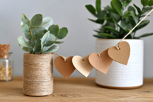 Decorative fabric heart garland in warm tones, a Holiday Photo by AlyaAnd