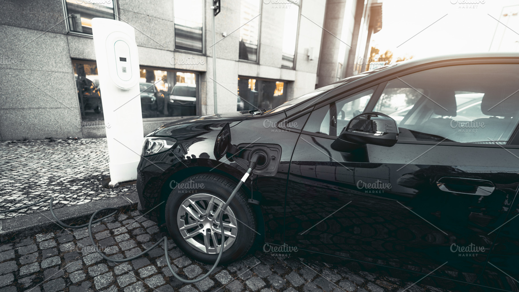 Electric car charging on city street, a Transportation Photo by SkyNext