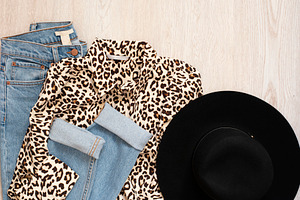 Women fashion clothes on wooden back containing clothes, collage, and winter
