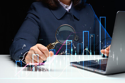 Woman sits at a laptop in front of a holographic chart with grow, a Business Photo by ndanko