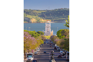 Belem Tower and Jacaranda-Lined, an Architecture Photo by kavalenkava