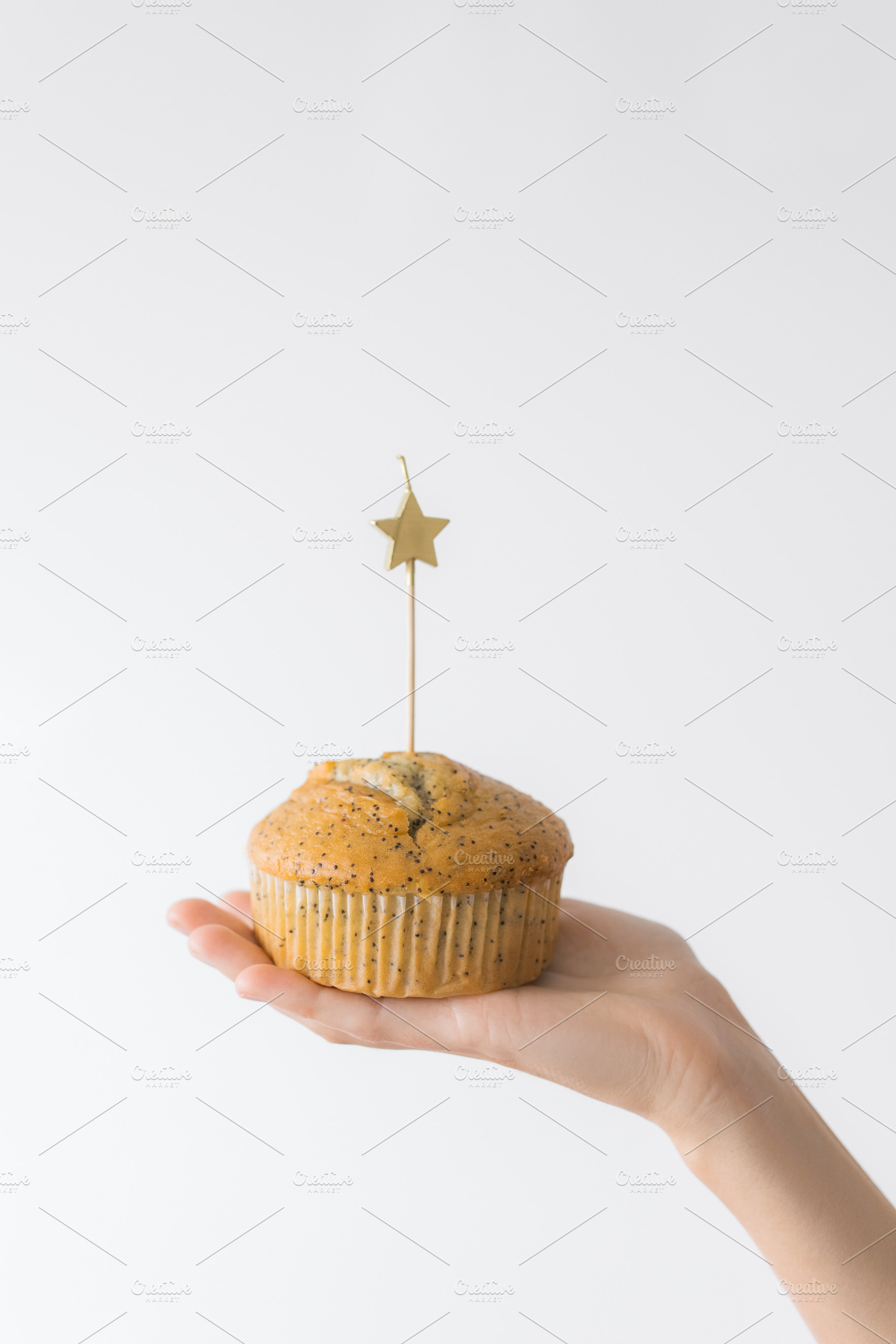 Birthday cupcake with a lit candle, a Food & Drink Photo by Kolomiyets Viktoriya