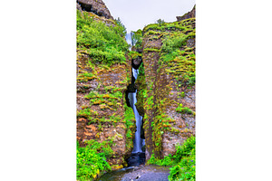 Gljufrafoss or Gljufrabui, waterfall obscured by a rock - Iceland, a Nature Photo by Leonid Andronov