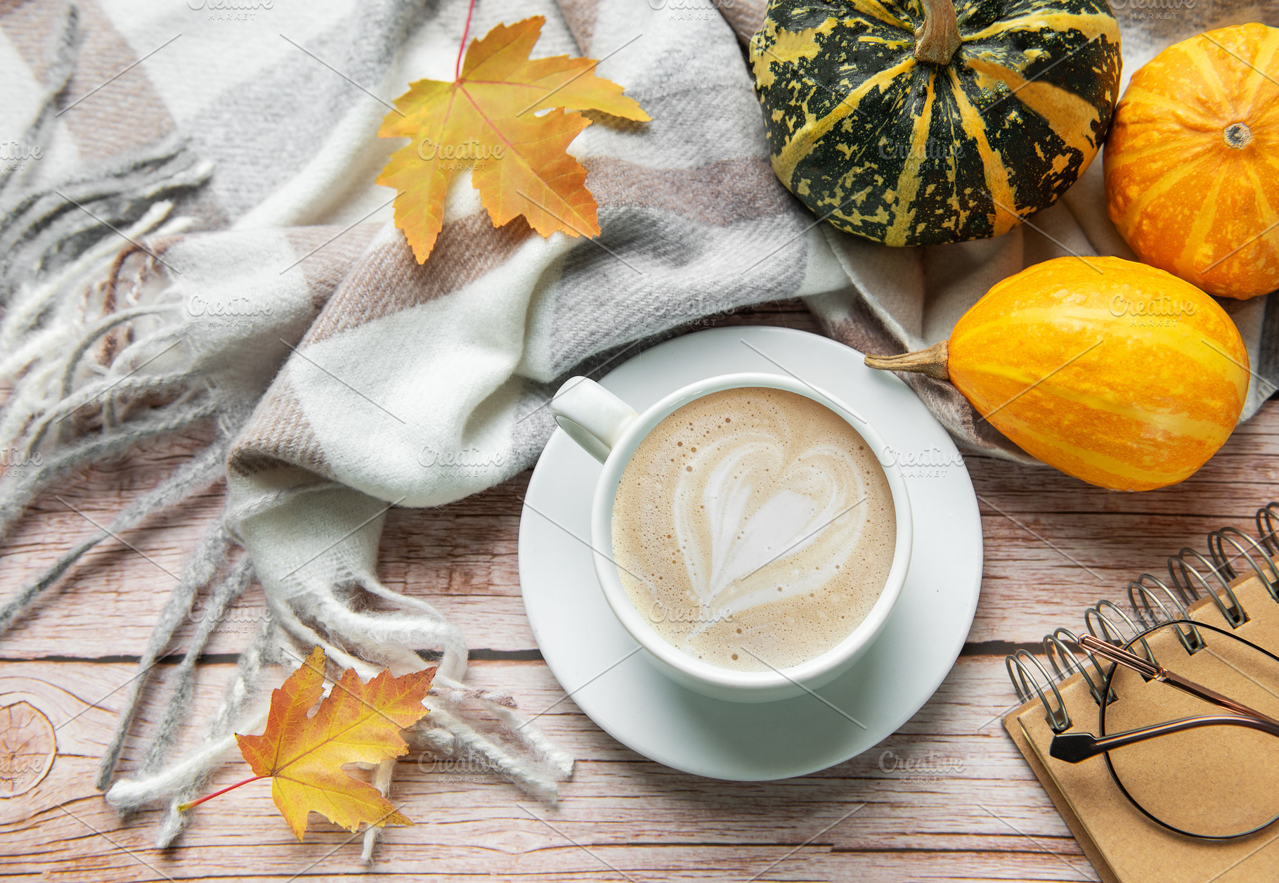 Autumn decoration with coffee cup, pumpkins, and a warm blanket, a Food & Drink Photo by Olena Rudo