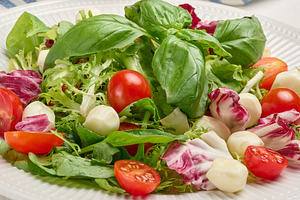 Fresh salad with mixed greens, radicchio and cherry tomatoes, a Food & Drink Photo by ndanko