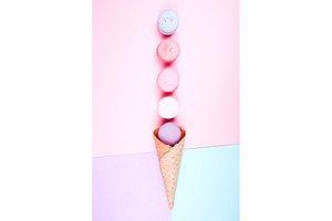 Stack of macarons in waffle cone, a Food & Drink Photo by Anna Efetova