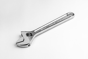 Adjustable wrench isolated photo, an Industrial Photo by FineArtStudio