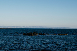 Scenic view of Akranes coastline and ocean with clear blue skies, a Photo by AS photostudio
