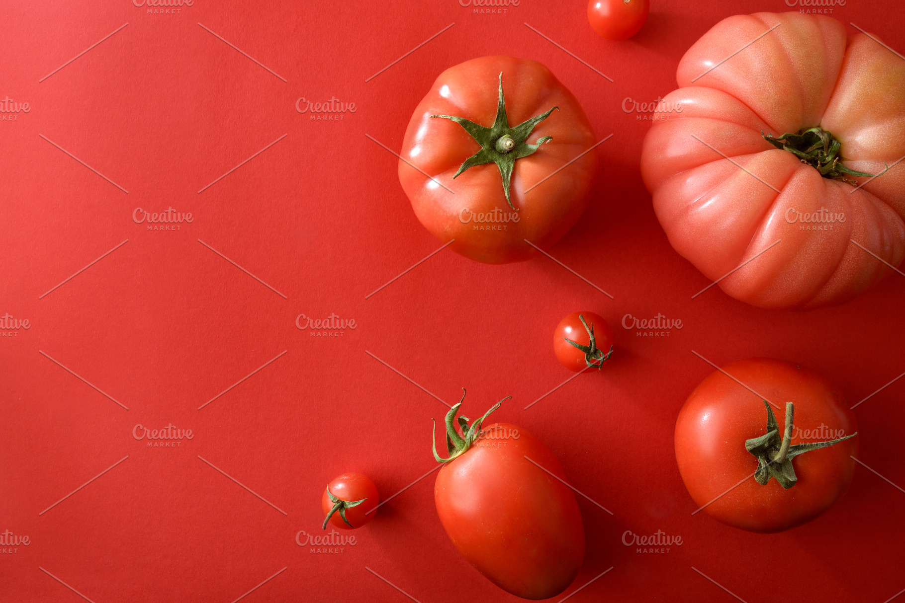 Assorted Tomatoes on Red Background, a Food & Drink Photo by Davizro's Market