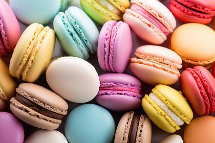 Colorful macarons dessert background, a Food & Drink Photo by AlyaAnd