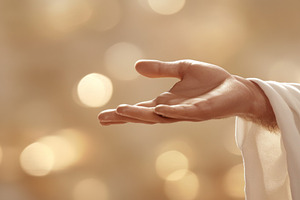 Hand of Jesus reaching out with light in spiritual scene, copy s, a Photo by Dvoevnore photos