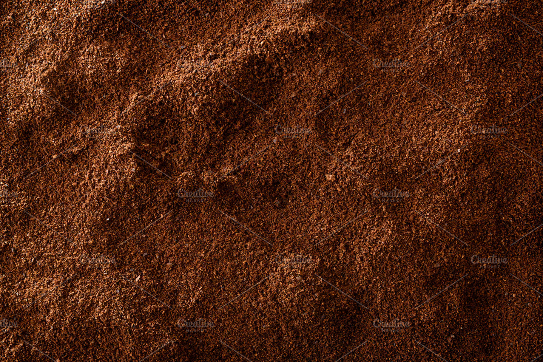 Brown background of ground coffee, a Food & Drink Photo by Davizro's Market