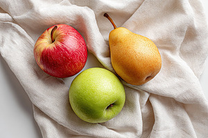 Seasonal fruits displayed elegantly on a soft cloth in natural light, a Food & Drink Photo by AlyaAnd