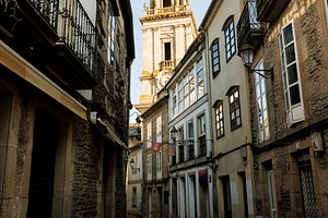 Narrow Cobblestone Street Leading to Cathedral Bell Tower, Lugo,, an Architecture Photo by Bepslabor