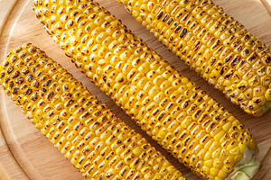 Three grilled corn cobs, a Food & Drink Photo by Alexander Prokopenko