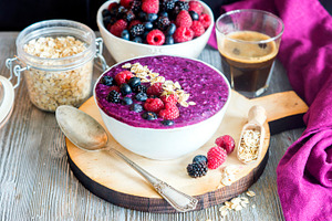 Healthy beautiful oatmeal berry smoothie bowl for breakfast